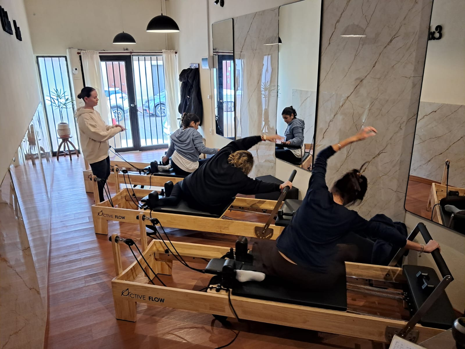 Clase de Pilates en reformer